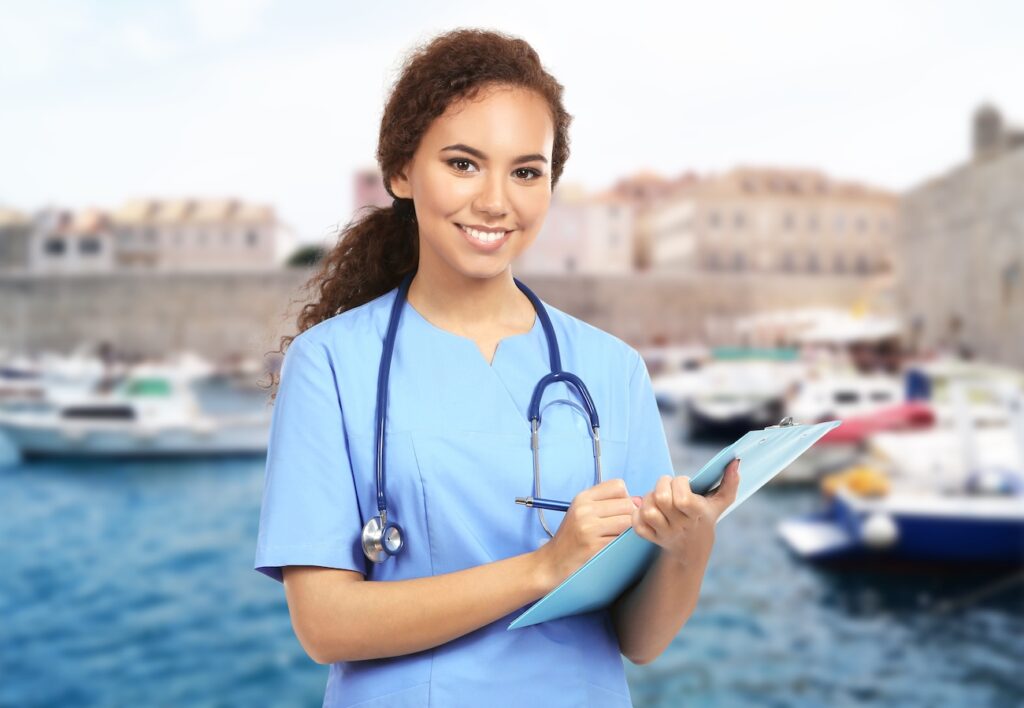 Female travel healthcare worker in a scenic background